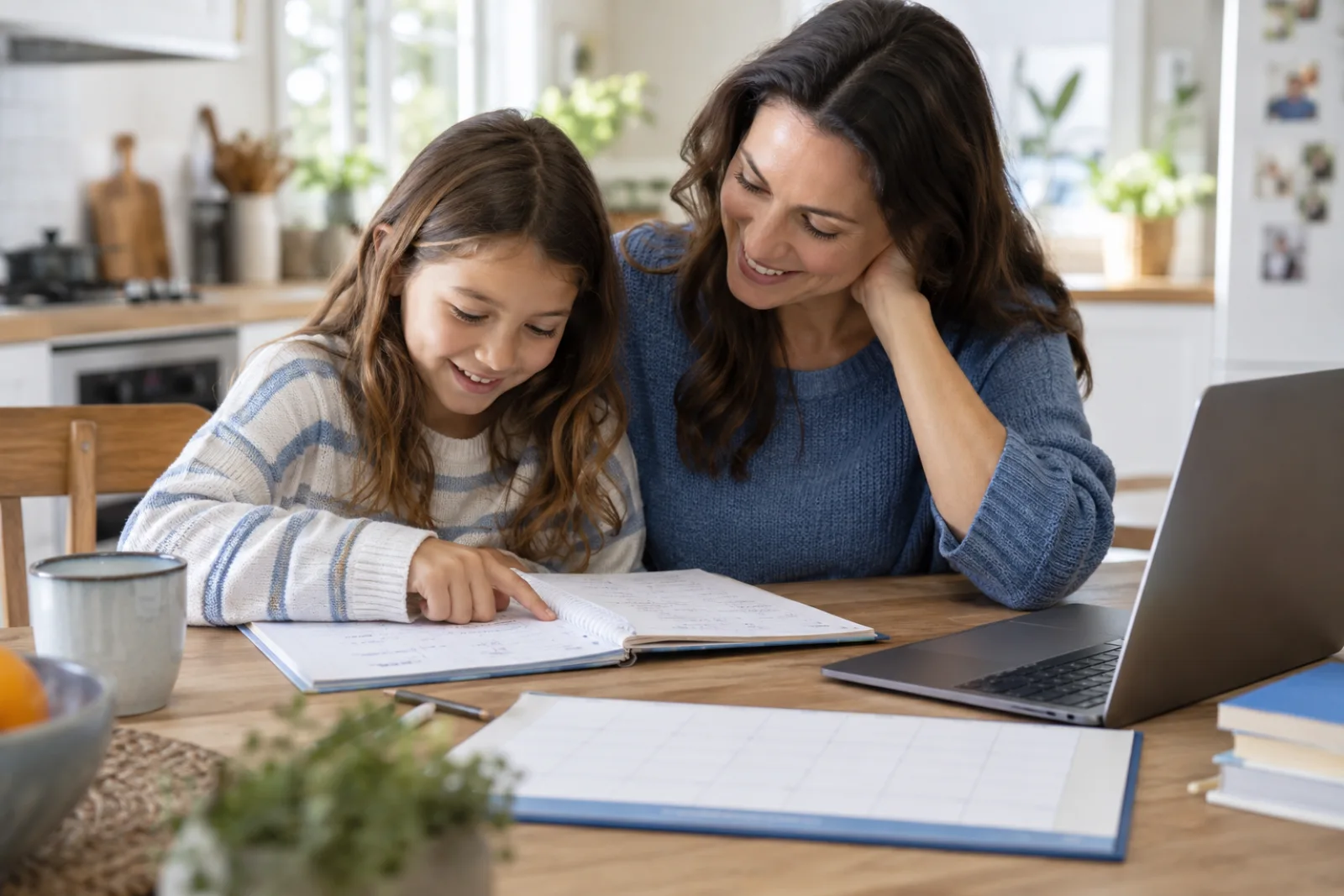 A family organizing a notebook and school materials